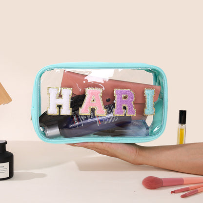 Bolsa de cosméticos impermeable de PVC transparente con letras bordadas