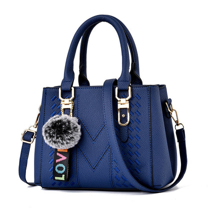 Bolso de mano informal con bola de pelo de color liso para mujer
