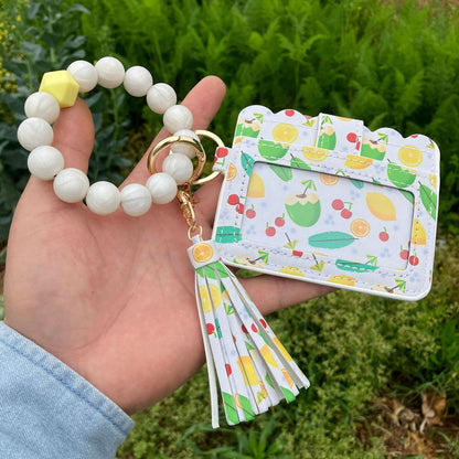 Cartera con pulsera y borlas de silicona estampadas a la moda