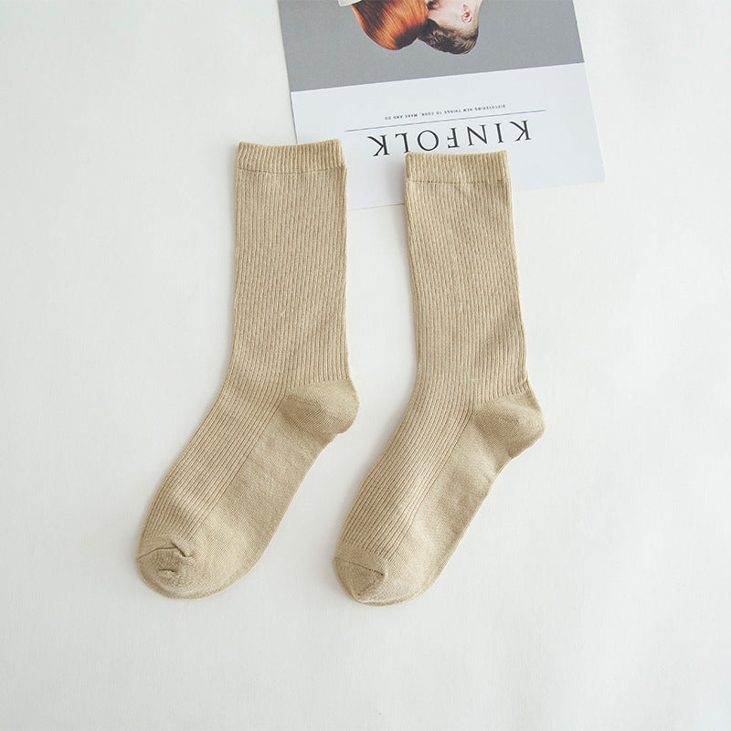 Calcetines de tubo de color liso sencillos a la moda para mujer