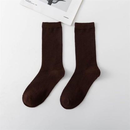 Calcetines de tubo de color liso sencillos a la moda para mujer