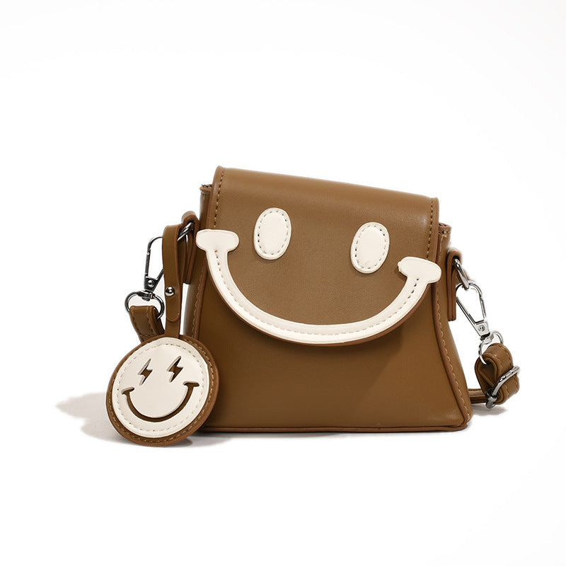 Lindo bolso bandolera mini con carita sonriente de dibujos animados