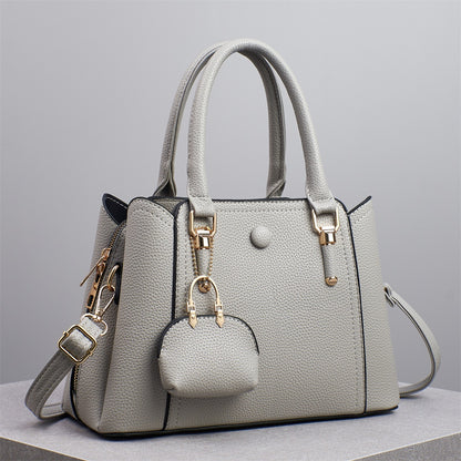 Bolso de mano informal de gran capacidad y color liso para mujer, con cierre de cremallera.