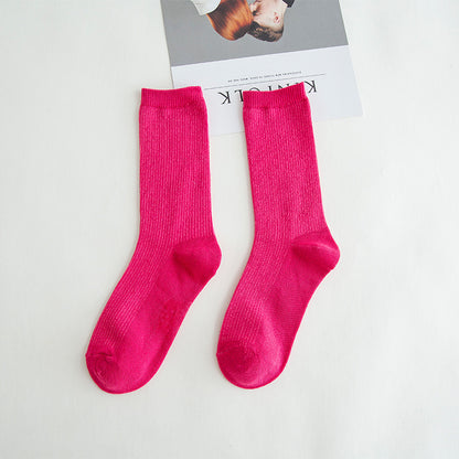 Calcetines de tubo de color liso sencillos a la moda para mujer