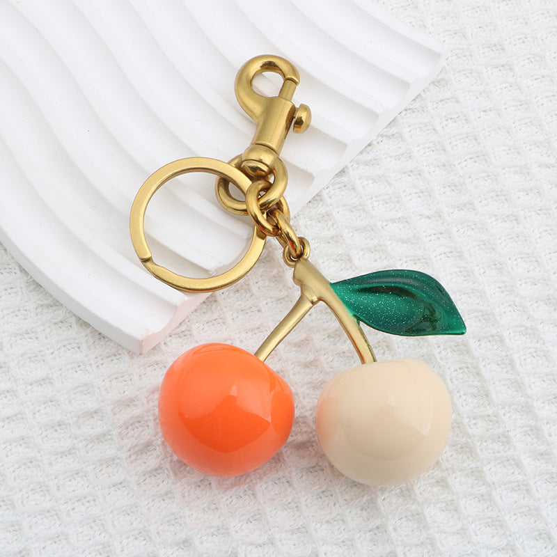 Llavero con colgante de resina con forma de cereza para bolso de mujer