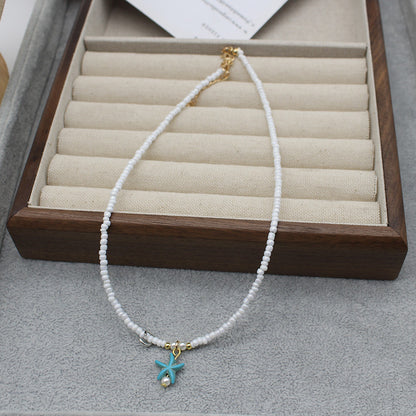 Collar con colgante de estrella de mar y cuentas de moda para mujer con detalles de aleación.