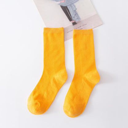 Calcetines de tubo de color liso sencillos a la moda para mujer