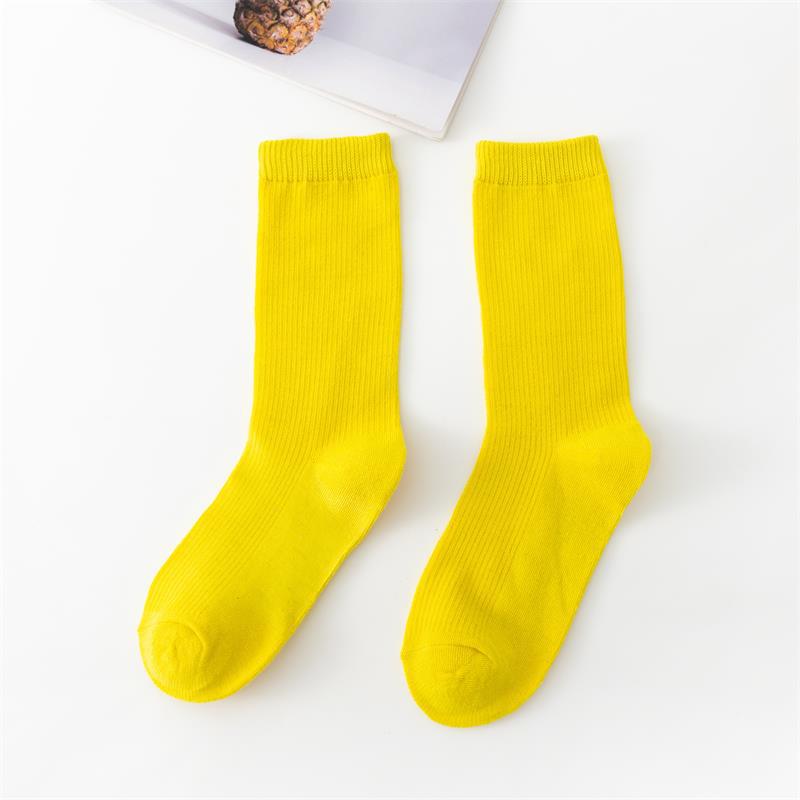 Calcetines de tubo de color liso sencillos a la moda para mujer