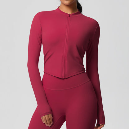 Top deportivo de manga larga de color liso a la moda para mujer
