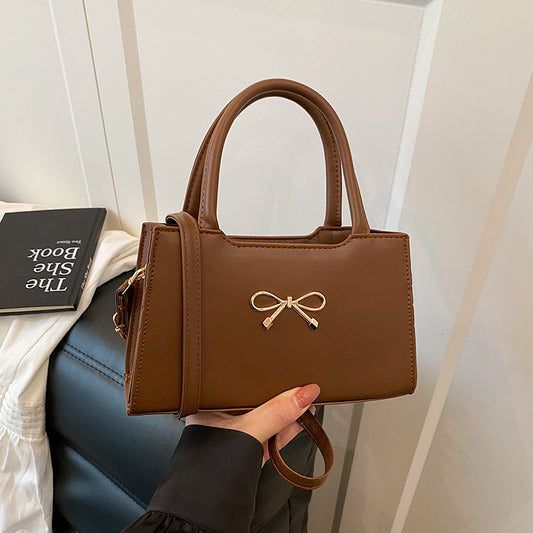 Bolso de mano informal de PU de color sólido con hebilla de lazo para mujer