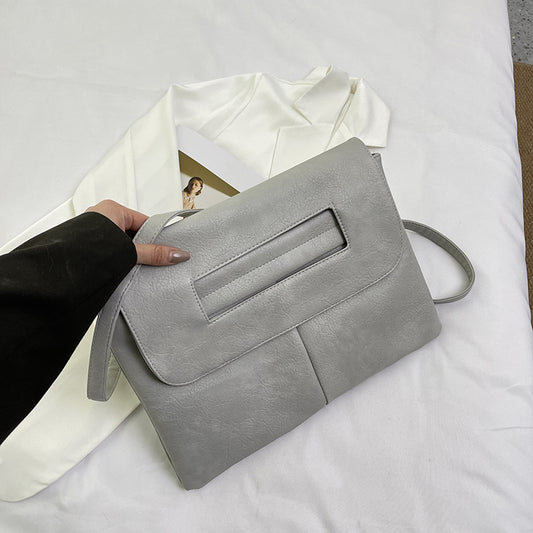 Bolso de mano tipo sobre de color liso para mujer, sencillo y moderno.