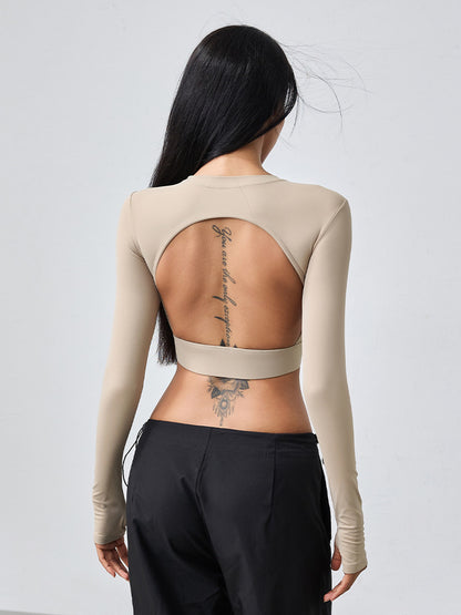 T-shirt de yoga moulant dos nu à manches longues et ajouré