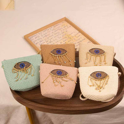 Bolso bandolera informal de paja con diseño de ojo malvado para niñas