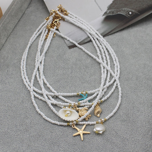 Collar con colgante de estrella de mar y cuentas de moda para mujer con detalles de aleación.