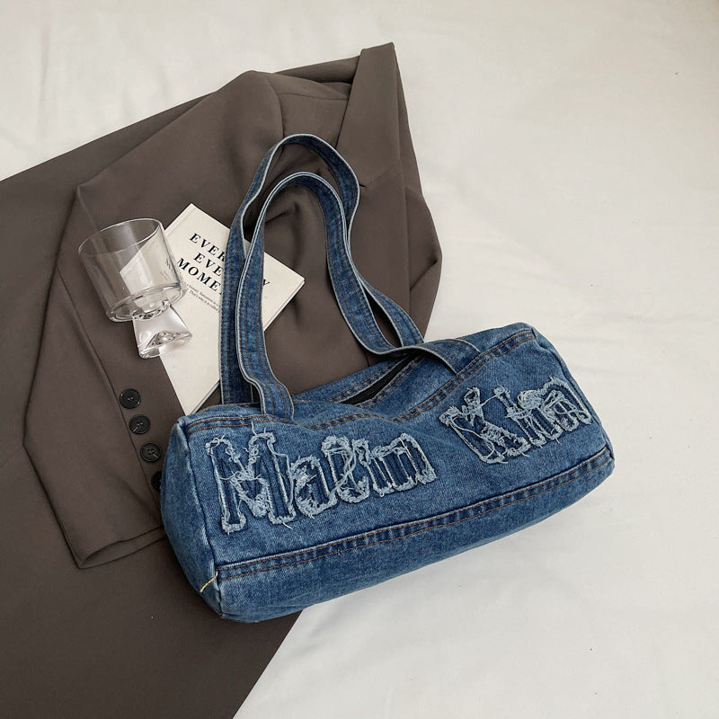 Bolsos de mezclilla con agujeros y bordado de letras vintage