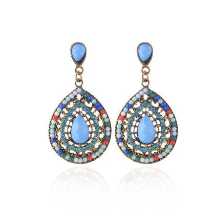 Pendientes colgantes con piedras preciosas huecas de estilo bohemio para mujer