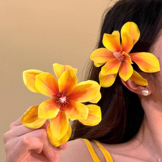 Horquilla floral amarilla para vacaciones en la playa
