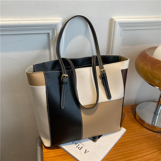 Bolso de mano de gran capacidad con costuras de moda en color