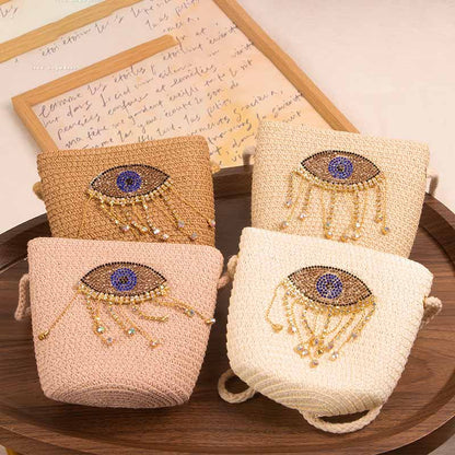 Bolso bandolera informal de paja con diseño de ojo malvado para niñas