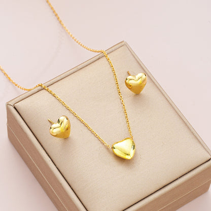 Conjunto de collar y pendientes con forma de corazón de oro, elegante y sencillo.