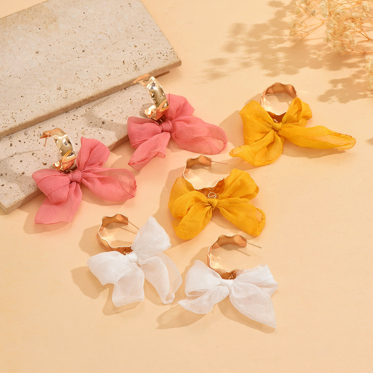 Boucles d'oreilles bohèmes en cuivre avec nœud pour les fêtes
