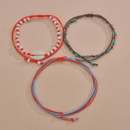 Conjunto de tobilleras bohemias multicapa con cuentas de concha