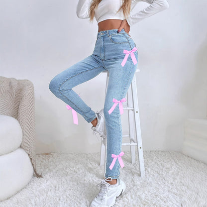 Jean moulant extensible à nœud latéral créatif pour femme