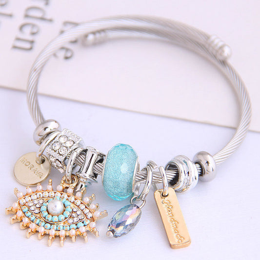 Pulsera de acero inoxidable con diseño vintage de mal de ojo para mujer