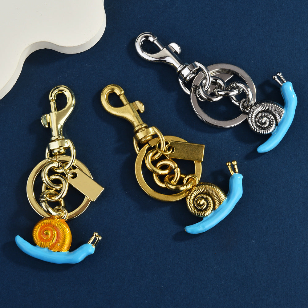 Llavero con colgante de bolso de caracol de moda, aleación orgánica marina, accesorios de moda