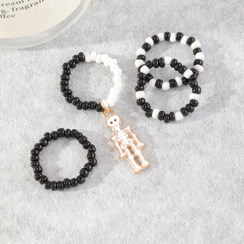 Anillos midi de calavera con cuentas blancas y negras para Halloween para mujer