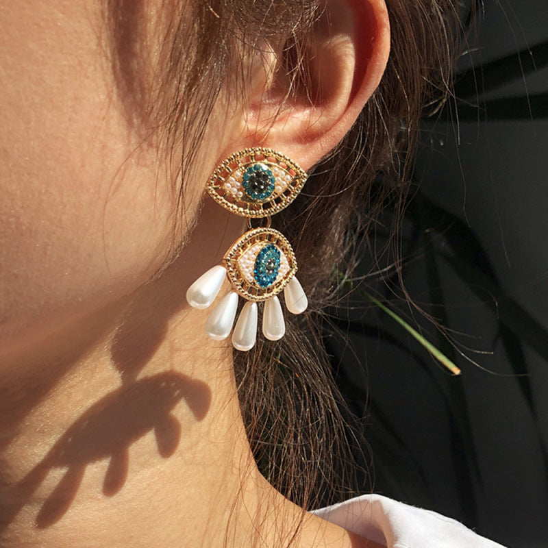 Pendientes de ojo de diablo con perlas de imitación de diamantes de imitación para mujer