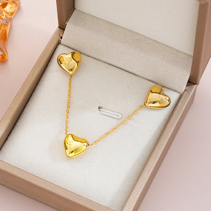 Conjunto de collar y pendientes con forma de corazón de oro, elegante y sencillo.