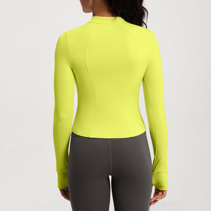 Top de yoga de manga larga con media cremallera de color liso a la moda para mujer