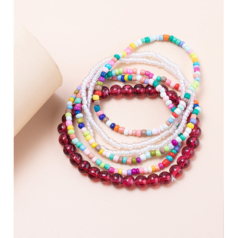 Conjunto de pulseras en capas con minicuentas multicolores bohemias