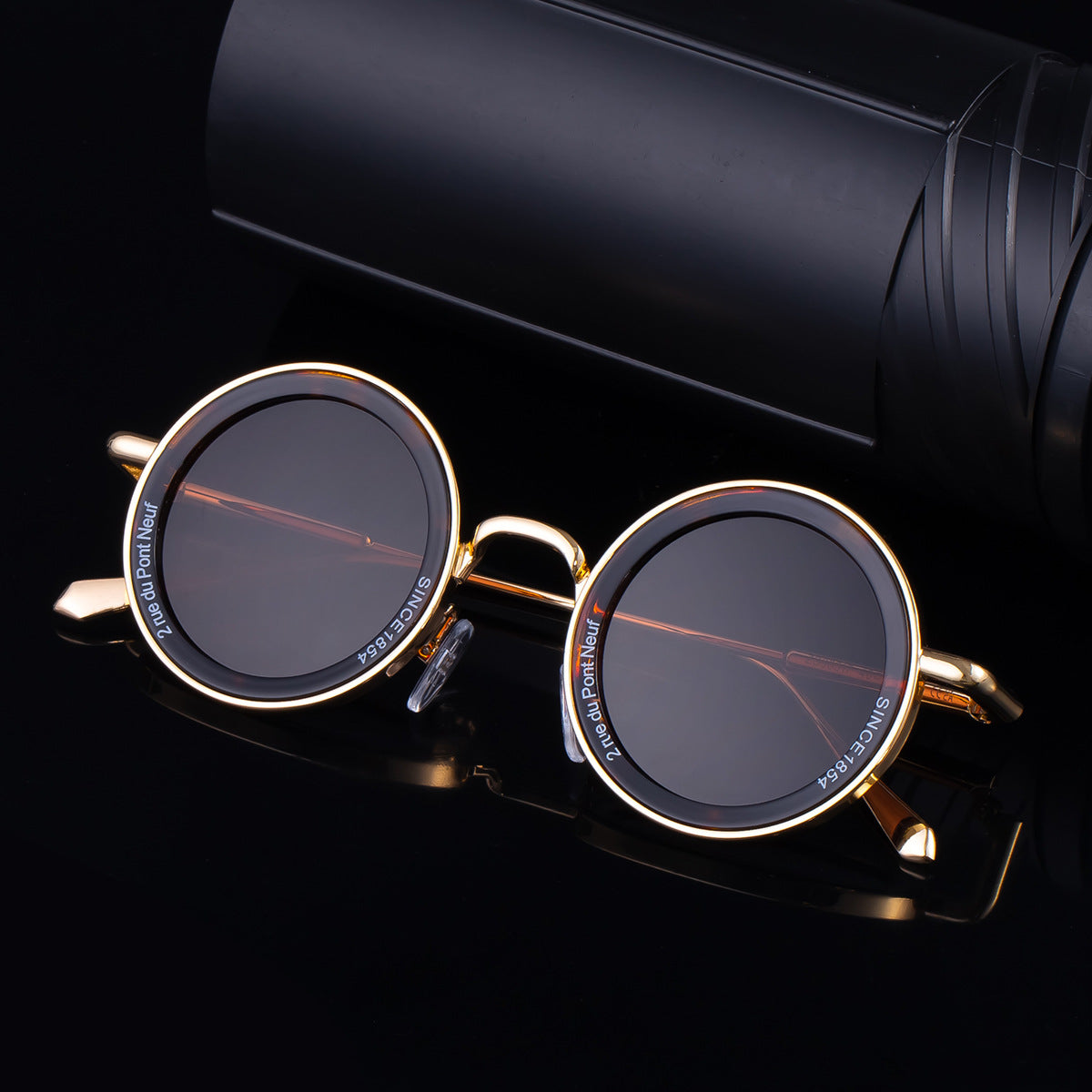 Gafas de sol redondas clásicas con montura metálica y colores sólidos para hombre