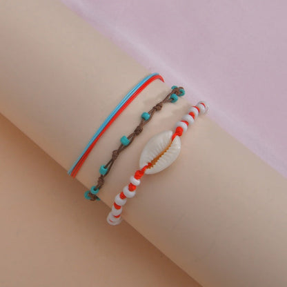 Conjunto de tobilleras bohemias multicapa con cuentas de concha