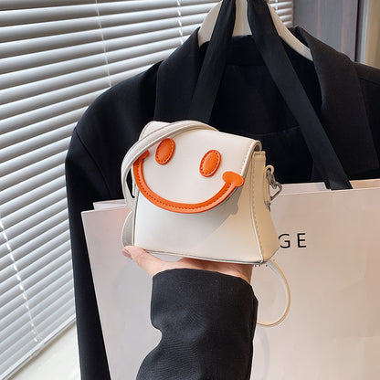 Lindo bolso bandolera mini con carita sonriente de dibujos animados