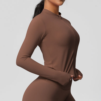 Top deportivo de manga larga de color liso a la moda para mujer