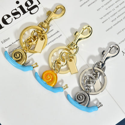 Llavero con colgante de bolso de caracol de moda, aleación orgánica marina, accesorios de moda