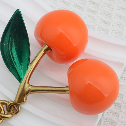 Llavero con colgante de resina con forma de cereza para bolso de mujer