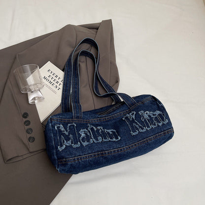 Bolsos de mezclilla con agujeros y bordado de letras vintage