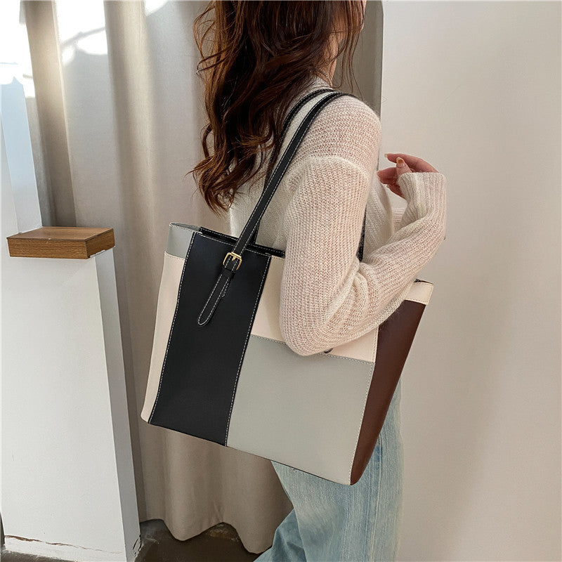 Bolso de mano de gran capacidad con costuras de moda en color