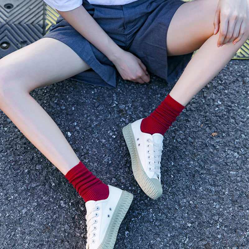 Calcetines de tubo de color liso sencillos a la moda para mujer