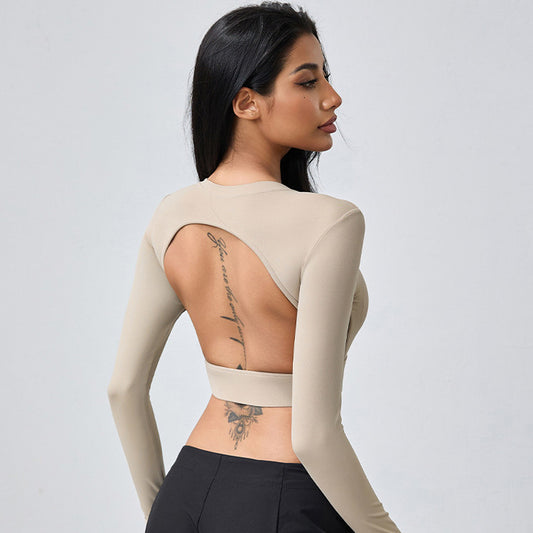 T-shirt de yoga moulant dos nu à manches longues et ajouré