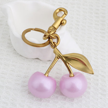 Llavero con colgante de bolso de cereza a la moda para mujer, de resina y aleación de zinc