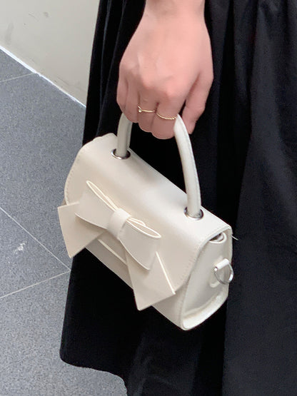 Bolso de mano pequeño cuadrado con lazo de color liso elegante para mujer