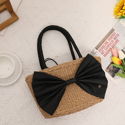 Bolso de mano tejido de paja con lazo bohemio