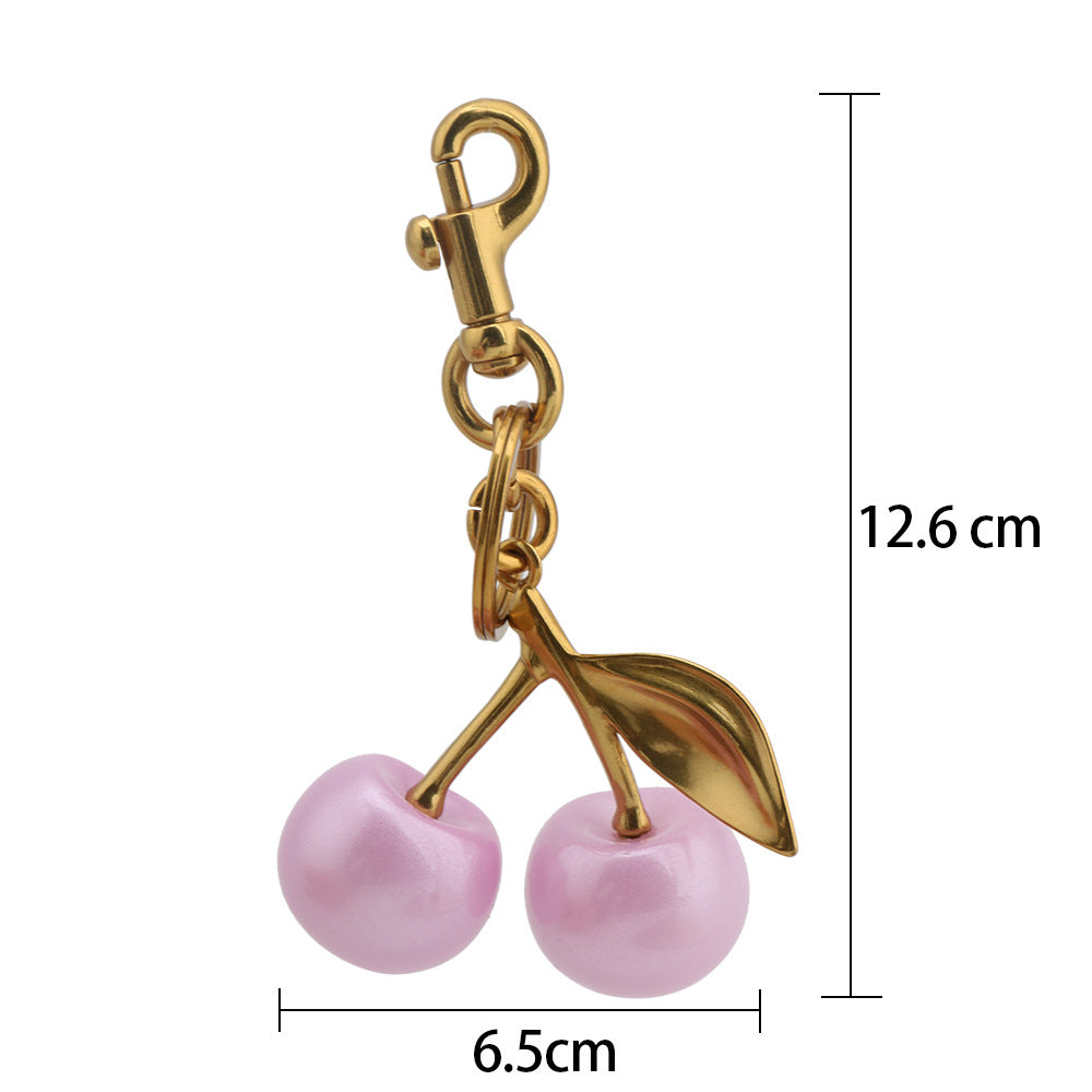 Llavero con colgante de bolso de cereza a la moda para mujer, de resina y aleación de zinc