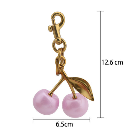 Llavero con colgante de bolso de cereza a la moda para mujer, de resina y aleación de zinc