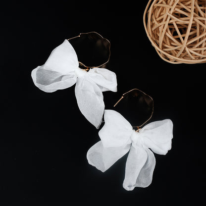 Boucles d'oreilles bohèmes en cuivre avec nœud pour les fêtes